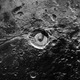 Elliot Crater (center) cut by Virgil Fossae (extending from lower left to center).